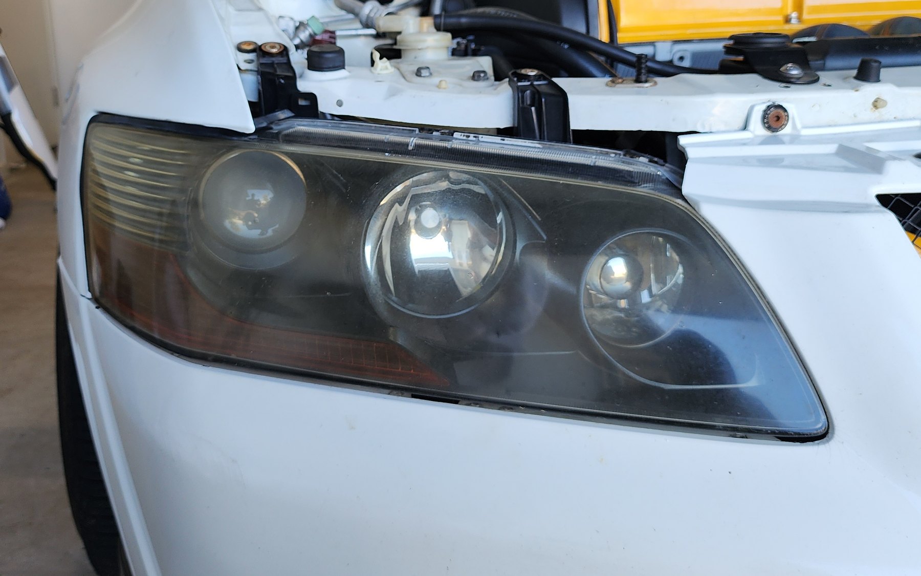 Hazy, oxidised headlight before restoration