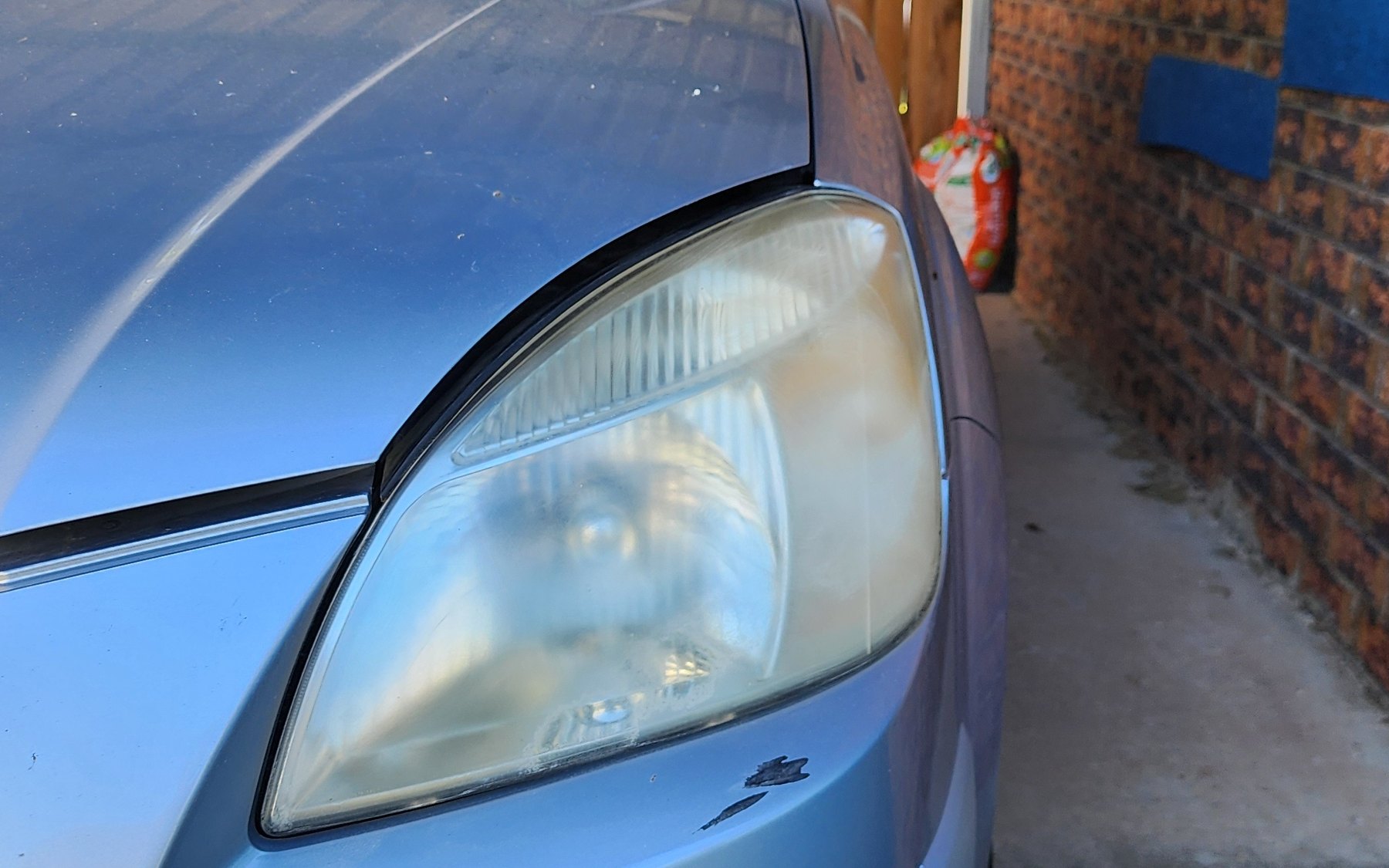 Hazy, oxidised headlight before restoration